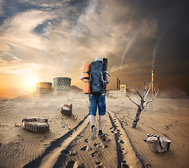 Image showing Tourist in a sandy desert