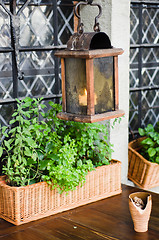 Image showing Lantern above a little table of street cafe