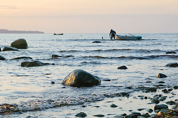 Image showing Fishing boats on the coast of the Baltic Sea at sunset