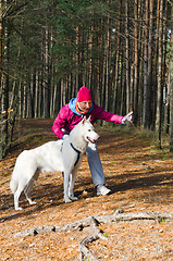 Image showing The woman with a dog in a forest park