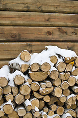 Image showing Birch fire wood at a wall of the house in winter