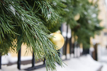 Image showing Christmas fir tree decorated with balloons and is sprinkled with