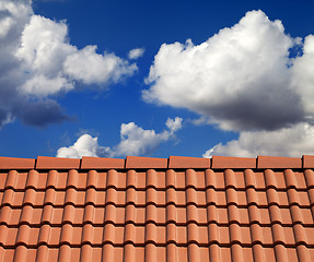 Image showing Roof tiles and cloudy sky