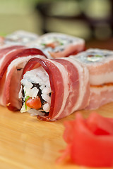 Image showing Sushi roll with bacon