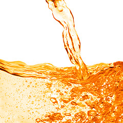 Image showing orange water splash isolated on white