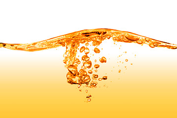 Image showing orange water splash isolated on white