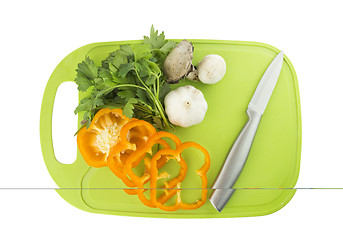 Image showing Parsley and mushroom on green Plastic board