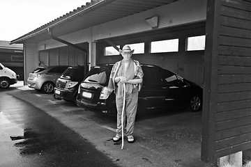 Image showing A man and cars