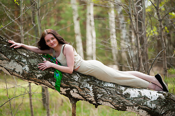 Image showing Beautiful woman on birch