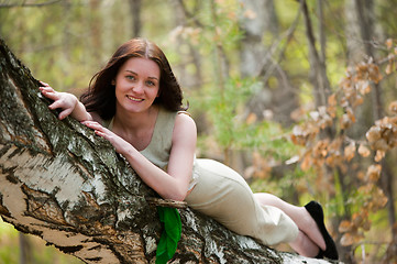 Image showing Beautiful woman on birch