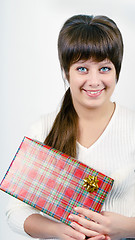 Image showing young woman with packaged gift