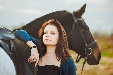 Image showing Young woman with a horse on nature