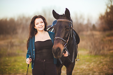 Image showing Young woman with a horse on nature