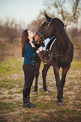 Image showing Young woman with a horse on nature