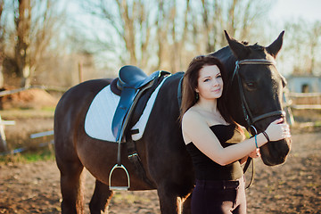 Image showing Young woman with a horse on nature