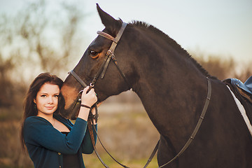 Image showing Young woman with a horse on nature