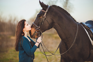 Image showing Young woman with a horse on nature