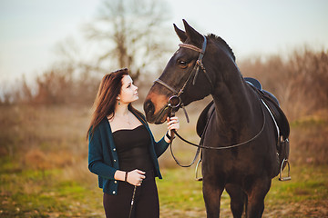 Image showing Young woman with a horse on nature