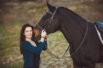 Image showing Young woman with a horse on nature