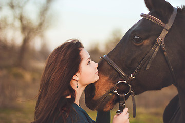 Image showing Young woman with a horse on nature