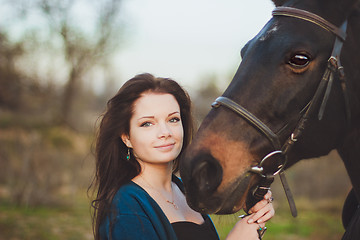 Image showing Young woman with a horse on nature