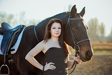 Image showing Young woman with a horse on nature