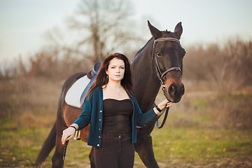 Image showing Young woman with a horse on nature