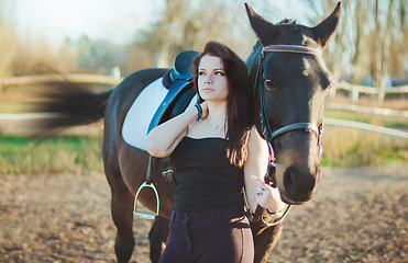 Image showing Young woman with a horse on nature