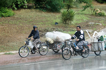 Image showing The collectors of cans and plastic