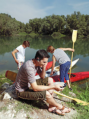 Image showing men with canoe in nature l