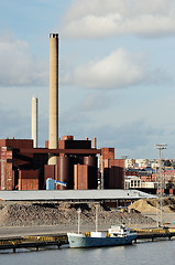 Image showing industrial building and chimney and boat