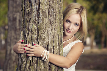 Image showing Embracing a tree