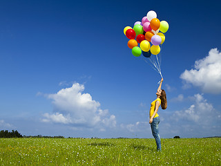 Image showing Girl with colorful balloons