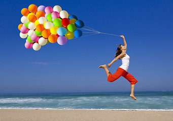 Image showing Jumping with balloons