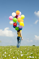 Image showing Girl with colorful balloons