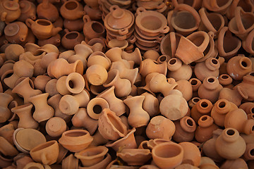 Image showing Big pile of clay pots on the market