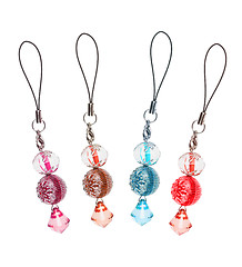 Image showing pendants for mobile phone of colored glass. collage 