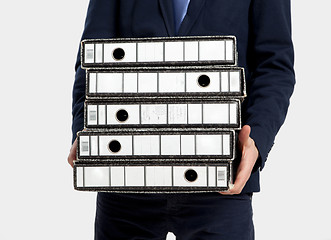 Image showing Business man carrying folders