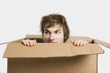 Image showing Man inside a card box