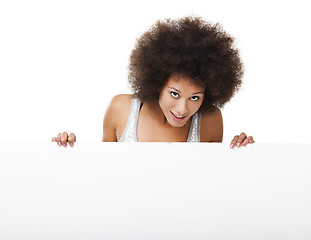 Image showing Woman holding a white billboard