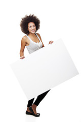 Image showing Woman holding a white billboard