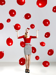 Image showing Woman with red ballons