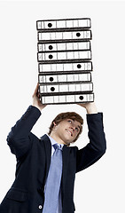 Image showing Business man carrying folders