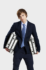 Image showing Business man carrying folders