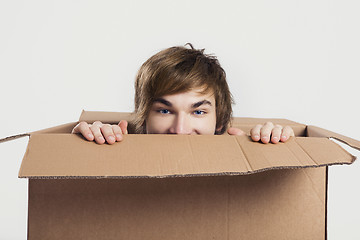 Image showing Man inside a card box