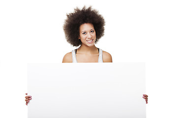 Image showing Woman holding a white billboard