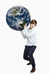 Image showing Holding a planet earth