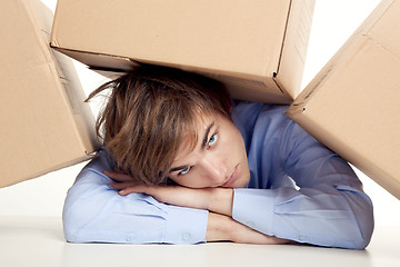 Image showing Man under boxes