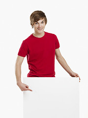 Image showing Man holding a cardboard
