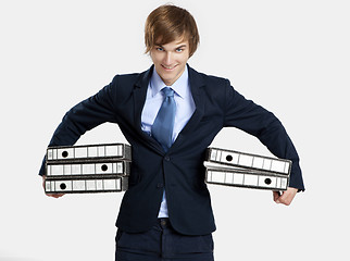 Image showing Business man carrying folders